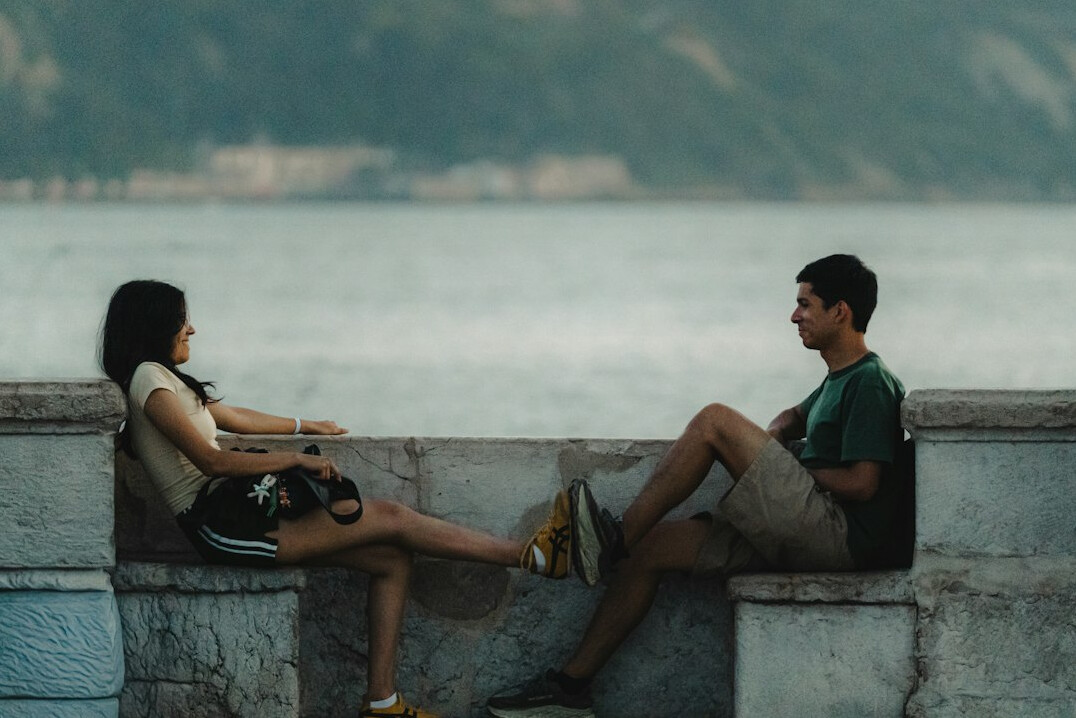 Two people having a serious conversation outdoors